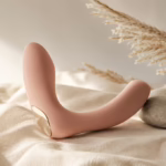 Elegant minimalist intimate wellness device styled as editorial still life